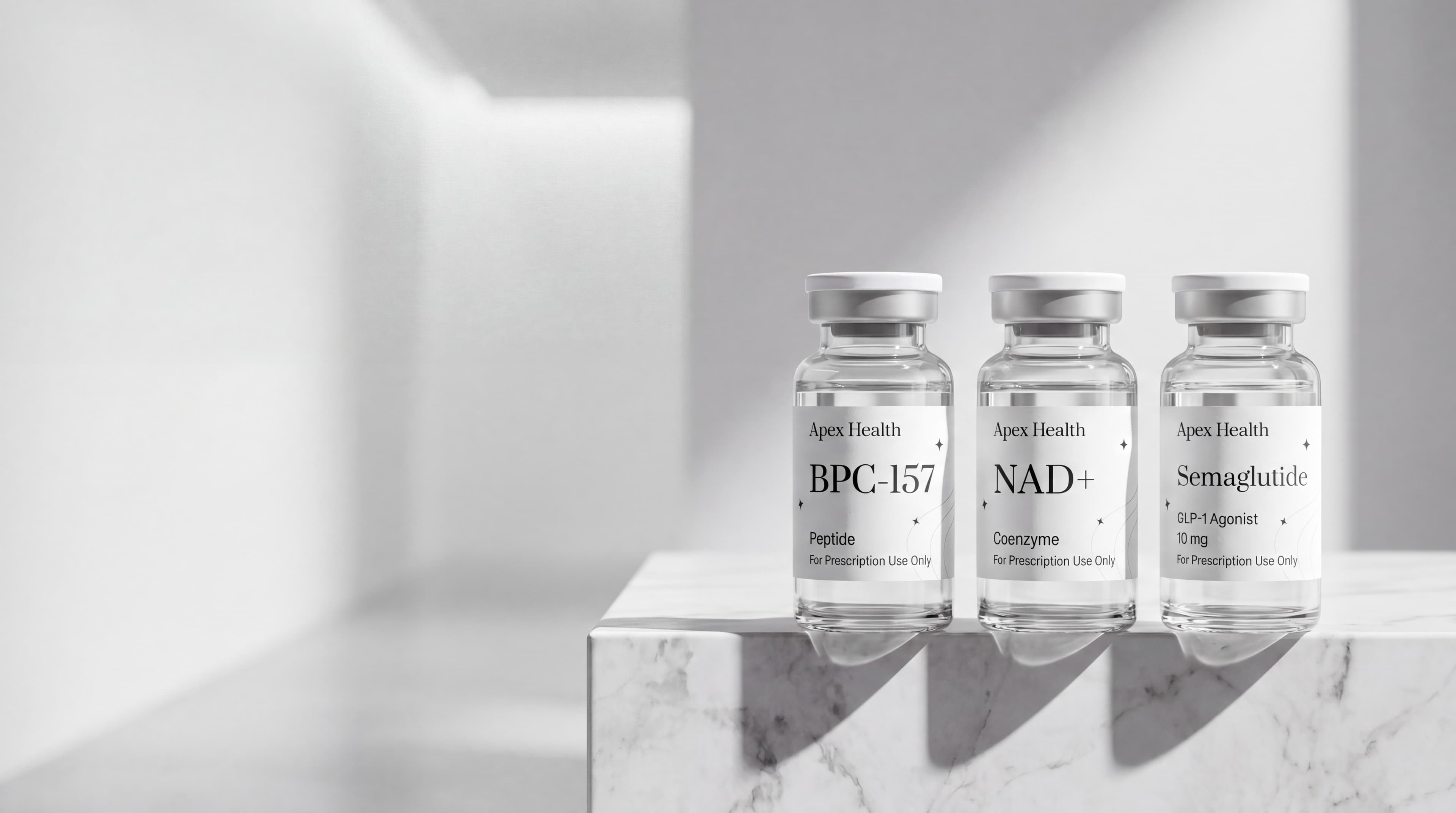 BPC-157, NAD+, Semaglutide vials on marble plinth